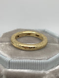 Two matched 14ct gold hammered bands