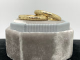 Two matched 14ct gold hammered bands