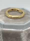 Two matched 14ct gold hammered bands